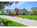 Beautiful home featuring a large driveway and a well-manicured front yard at 223 Haldale Dr, Carmel, IN 46032