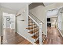 Inviting foyer with hardwood floors and a staircase leading to the upper level at 223 Haldale Dr, Carmel, IN 46032