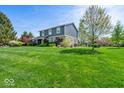 Landscaped yard with vibrant plants and trees highlighting this home's curb appeal at 223 Haldale Dr, Carmel, IN 46032