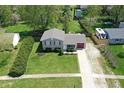 An elevated view of a charming two-story home with a well-maintained lawn and driveway at 251 Yorktown Rd, Greenwood, IN 46142