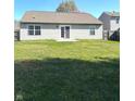 Spacious backyard with a green lawn and a patio area, perfect for outdoor activities at 2629 Calabash Dr, Indianapolis, IN 46217