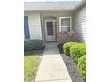 Close-up of front entrance with well-kept landscaping and a clean concrete walkway at 2629 Calabash Dr, Indianapolis, IN 46217
