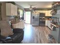 Modern kitchen with stainless steel appliances, plenty of cabinet space, and open access to the backyard at 2650 Woodrow Ave, Indianapolis, IN 46241