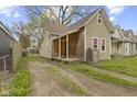 View of a cute home with a cozy front porch at 314 N Reisner St, Indianapolis, IN 46222