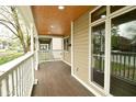 Spacious front porch featuring recessed lighting and white railings at 344 N Addison St, Indianapolis, IN 46222
