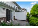 Private patio area with a privacy fence, accessible from the condo at 4948 Potomac Square Pl, Indianapolis, IN 46268