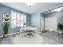 Bright office space with a white desk, comfortable seating, and natural light, perfect for working from home at 5110 Lilium Dr, Plainfield, IN 46168