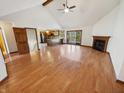 Spacious open concept living room with hardwood floors, fireplace, and vaulted ceilings at 6618 Crystal Springs Dr, Avon, IN 46123