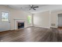 Bright living room features a cozy fireplace and new wood-look flooring throughout at 7652 Wood Stream Dr, Indianapolis, IN 46239