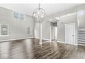 Open concept living room featuring modern lighting and a staircase leading to the second floor at 769 Raintree Dr, Avon, IN 46123