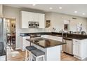 Bright kitchen with stainless steel appliances, granite countertops, and a functional center island at 8277 Plumwood Ln, Indianapolis, IN 46256