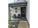 Cozy front porch featuring two chairs and a black-framed door, perfect for relaxing at 11651 Congressional Ln, Indianapolis, IN 46235