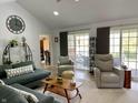 Inviting living room with vaulted ceilings, recessed lighting, and neutral decor, creating a cozy and stylish space at 12043 N Berling Dr, Mooresville, IN 46158
