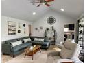 Inviting living room with vaulted ceilings, recessed lighting, and neutral decor, creating a cozy and stylish space at 12043 N Berling Dr, Mooresville, IN 46158