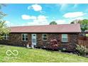 Charming brick home featuring classic architecture and a neatly kept lawn at 1355 Ash Ct, Martinsville, IN 46151