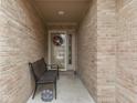 Inviting front porch with a bench and decorative elements, offering a warm welcome at 1395 Heron Ridge Blvd, Greenwood, IN 46143