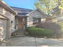 Inviting home exterior showcasing a front door with classic sidelights and attractive landscaping at 1605 Fox Dr, Martinsville, IN 46151
