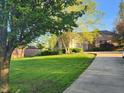 Well-maintained lawn and attractive landscaping leading up to a charming single-story home with an attached garage at 1605 Fox Dr, Martinsville, IN 46151