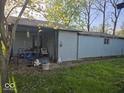 Covered back porch with furniture, perfect for relaxing outdoors at 1817 Sparrow Ave, Indianapolis, IN 46227