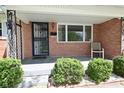 Cozy front porch with brick accents, decorative ironwork, and a comfortable seating area at 2220 Radcliffe Ave, Indianapolis, IN 46227