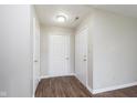 Entry hallway featuring new flooring, neutral wall color and multiple doors at 308 Creekstone Ct, Indianapolis, IN 46239