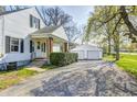 Exterior of the home showing a front entrance, detached garage, and long driveway at 333 N Jefferson St, Brownsburg, IN 46112