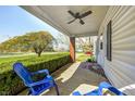 Inviting front porch with comfortable seating and a ceiling fan for enjoying the outdoors at 333 N Jefferson St, Brownsburg, IN 46112