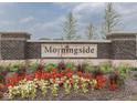 Morningside neighborhood brick sign enhanced by colorful landscaping, creating a welcoming entrance at 3697 Chalmers Dr, Bargersville, IN 46106