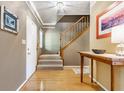 Welcoming entryway featuring hardwood floors, staircase, and stylish decor at 3808 Brigade Cir, Carmel, IN 46032