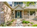 Close up of a charming front porch and entry way with detailed brickwork at 3808 Brigade Cir, Carmel, IN 46032