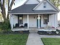 Charming home with a welcoming front porch and well-manicured lawn at 40 N Park Ave, Martinsville, IN 46151
