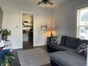 Comfortable living room with a gray sectional, leading into a well-equipped kitchen at 40 N Park Ave, Martinsville, IN 46151