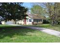 Charming home with well-maintained yard, garage, and quaint side porch at 4736 Madison Ave, Indianapolis, IN 46227