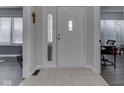 Bright entryway featuring neutral tile flooring and a front door with decorative glass at 4759 Silver Hill Dr, Greenwood, IN 46142