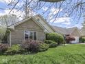 Charming home with lush lawn, mature shrubbery, and brick exterior at 4759 Silver Hill Dr, Greenwood, IN 46142