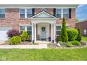 Inviting front porch with classic columns and decorative details at 5422 Portman Dr, Noblesville, IN 46062