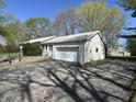 This home has an attached garage with ample driveway parking at 5822 W 62Nd St, Indianapolis, IN 46278