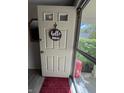 Close-up of the front door with a decorative 'Hello' sign, offering a warm welcome at 9415 Timber View Dr, Indianapolis, IN 46250
