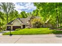 Charming two-story home with a landscaped lawn and mature trees in a serene, suburban setting at 10919 Running Tide Ct, Indianapolis, IN 46236