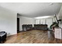 Spacious living room featuring hardwood floors and a comfortable gray sectional sofa at 12078 N 125 W, Alexandria, IN 46001