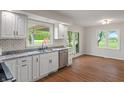 Bright, airy kitchen with white cabinets, stainless steel appliances, and a view to the backyard at 1285 S 1100 E, Zionsville, IN 46077