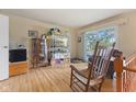 Cozy living room with hardwood floors and ample natural light from a large window at 150 Church St, Mooresville, IN 46158