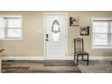 Bright entryway featuring a decorative door and modern flooring at 1509 S Spencer Ave, Indianapolis, IN 46203