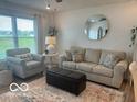 Cozy living room featuring comfortable seating, a plush rug, and plenty of natural light at 1511 Coen Ct, Columbus, IN 47201