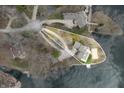 Stunning aerial view of a lakefront property with mature trees and a private dock at 2001 E Ely Ct, Martinsville, IN 46151