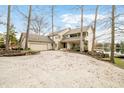 Beautiful two-story home with a spacious driveway and a two-car garage, surrounded by mature trees at 2001 E Ely Ct, Martinsville, IN 46151