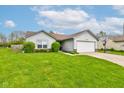 Charming single-story home with a well-maintained lawn, mature landscaping, and an inviting curb appeal at 2125 Jason Dr, Lebanon, IN 46052