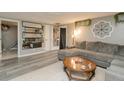 The expansive living room features an oversized couch, stylish lighting, and decorative wall art at 2658 S Rybolt Ave, Indianapolis, IN 46241