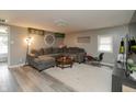 The inviting living room is furnished with a large, comfortable sectional couch and stylish decor at 2658 S Rybolt Ave, Indianapolis, IN 46241