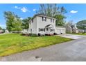 A lovely two-story home boasting a spacious yard, a front porch, and an attached two-car garage at 301 S B St, Thorntown, IN 46071
